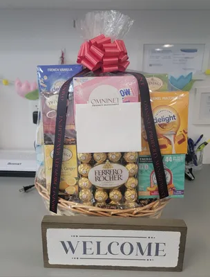 Hello here is a picture of our latest corporate gift basket with custom ribbon on it Thank you