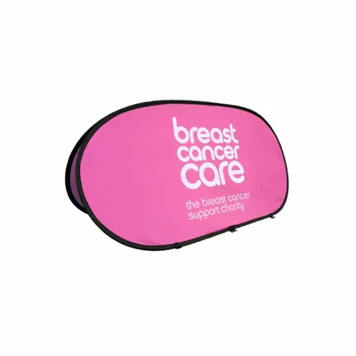 A pink promotional banner with 'breast cancer care - the breast cancer support charity' text for awareness, against a white background.
