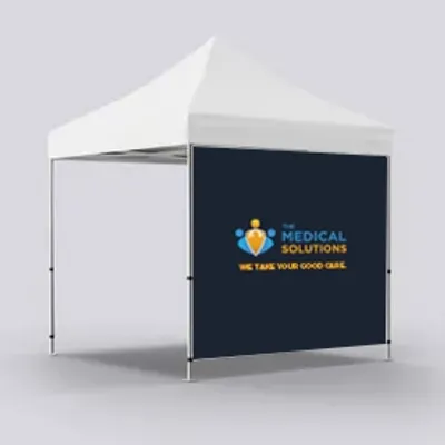 A custom-branded canopy tent with a white top and a backdrop featuring a logo and the text 'MEDICAL SOLUTIONS WE TAKE YOUR GOOD CARE.'
